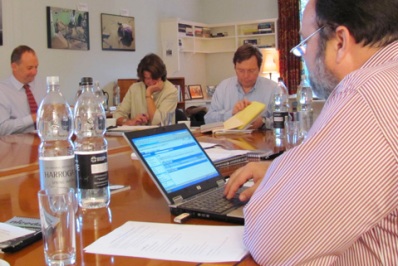 Workshop founder Chuck Lewis reviews his notes at the Oxford symposium.